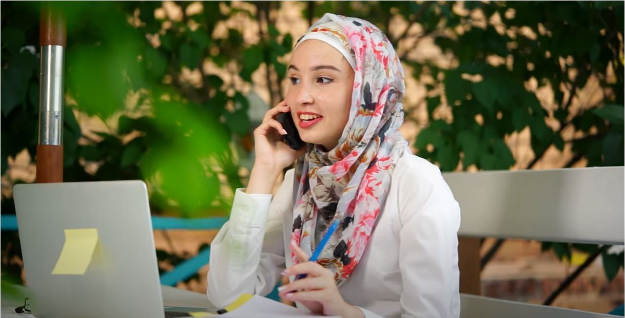 Woman at Computer on Phone